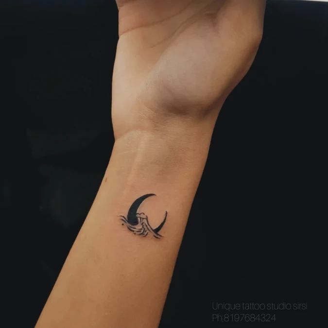 Dark Crescent Moon And Textured Water
