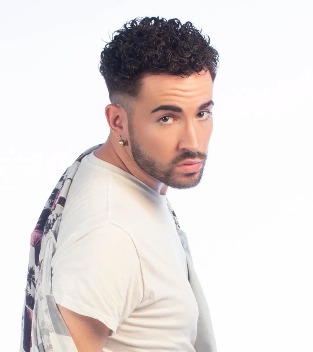 Defined Curly Top with Sharp Temple Fade