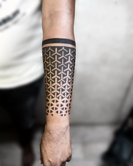 Fading Geometric Tile Pattern On The Forearm