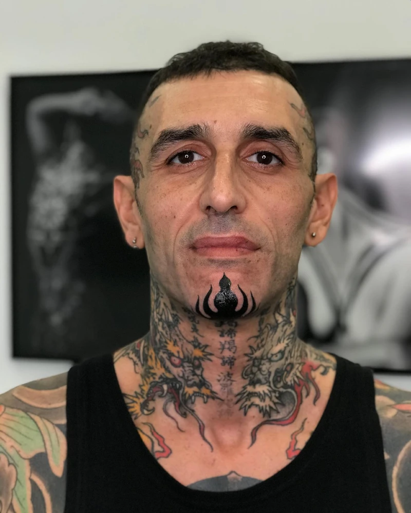 Solid Black Tribal Chin Motif Over Twin Neck Dragons