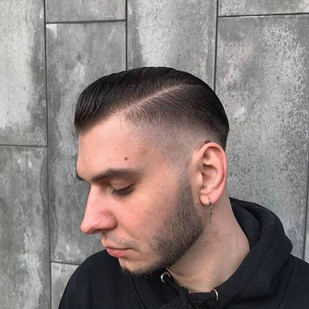 The Deep-Parted Pompadour with Skin Fade
