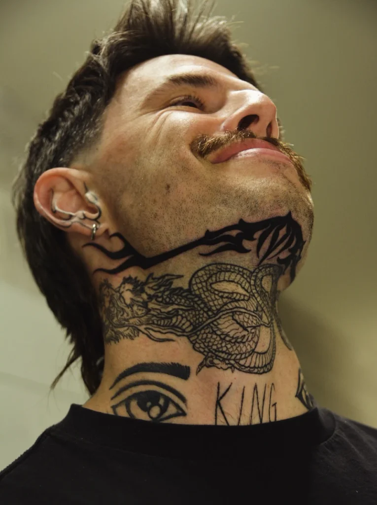 Tribal Jawline Spikes And Heavy Black Chin Ink