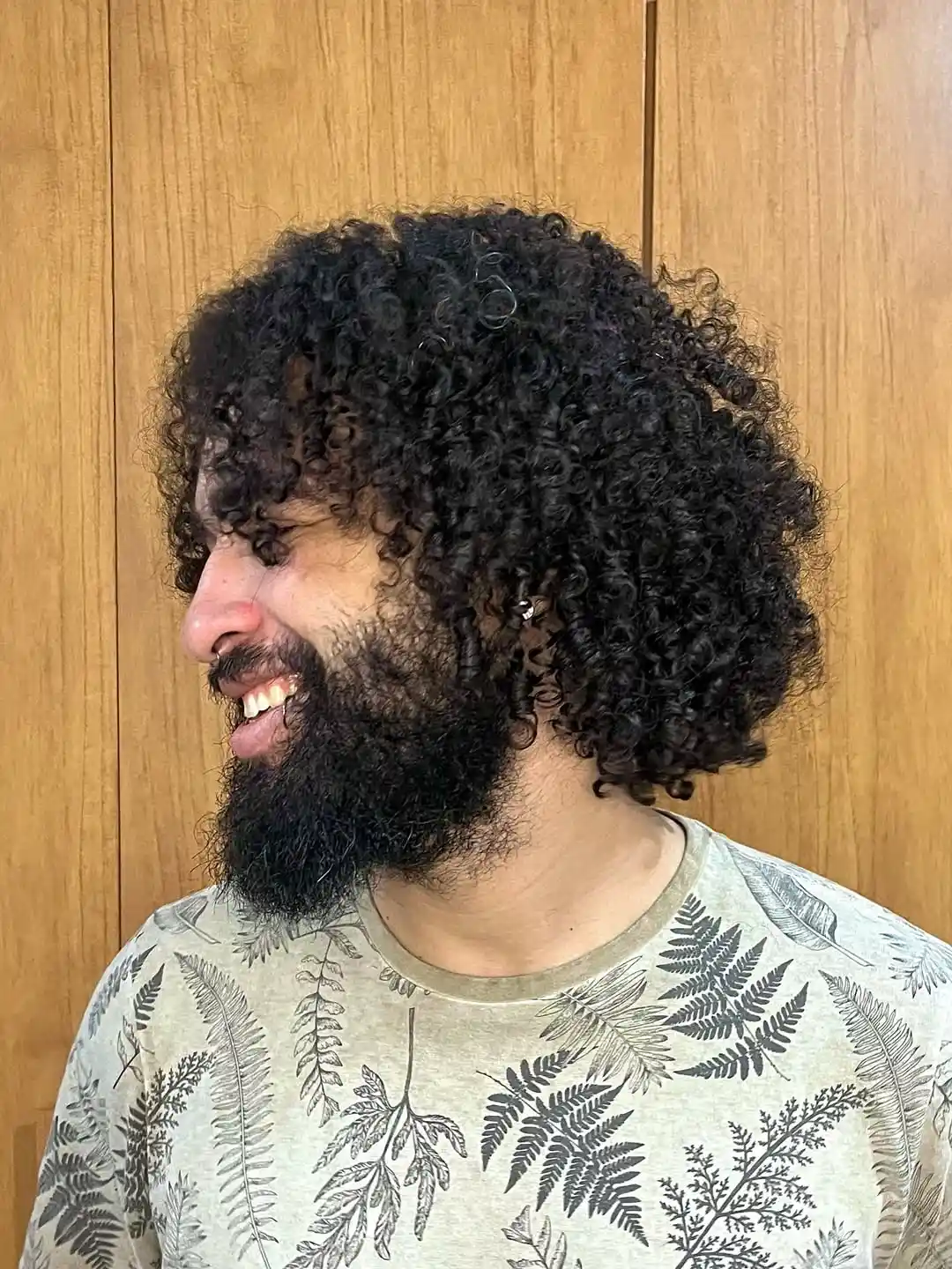 Voluminous Short Curly Style with Beard Integration