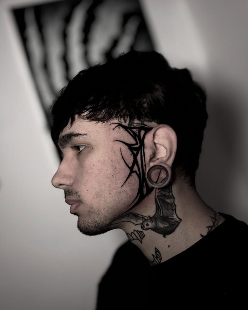 Fluid Tribal Line Work Jawline Framing