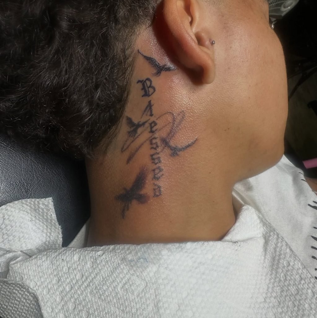 Vertical Script With Flying Bird Silhouettes