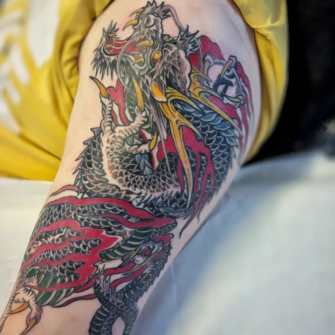 Japanese Dragon Arm Tattoo With Crimson Flame Accents