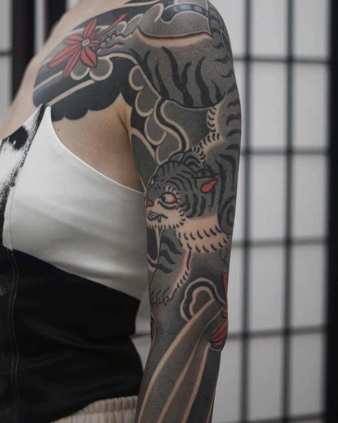 Black And Grey Tiger Sleeve Against Shoji Screens